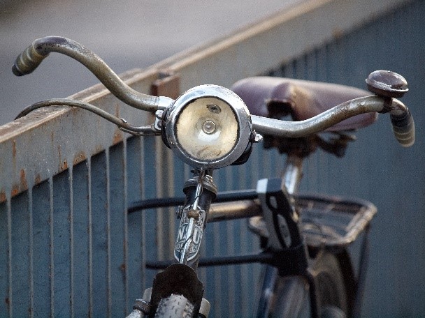 Photo of vintage bicycle locked to a fence