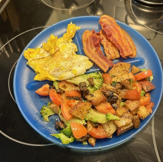Photo of Vickie's eggs, bacon, and vegetables