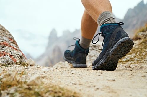 Photo of hiking boots walk the trail