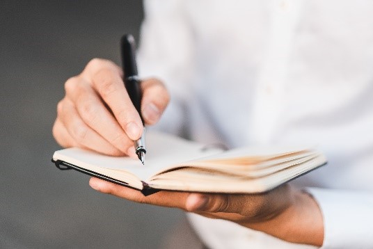 Photo of person writing with fountain pen