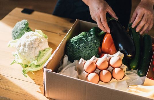 Photo of a person picking out vegetables