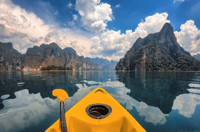 Photo of yellow kayak in mountain lake