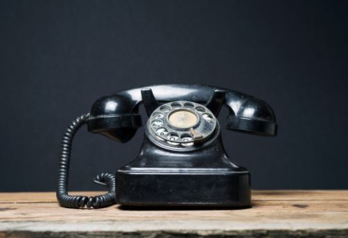 Photo of Closeup of a telephone on top of a table